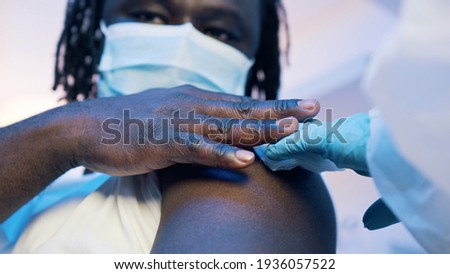 Close up , African american black man receiving vaccine against covid19. High quality photo