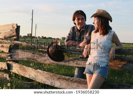 Cute couple on a walk by the countryside summer