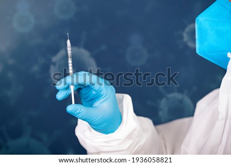Concept of herd immunity, virus spreading in society. Doctor with syringe is preparing for vaccine.