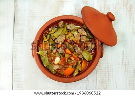 Keto Green Beans with Lamb Meat in a Clay Pot. Homemade healthy meal. Royalty-Free Stock Photo #1936060522