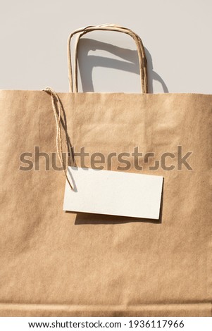 Paper reusable bag with blank white empty label card mock up. Delivery service and shopping concept