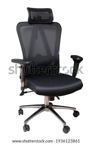 Closeup of a black comfortable office or computer swiwel chair isolated on white background. Clipping path. Ergonomic design chair for a healthy back. Royalty-Free Stock Photo #1936123861