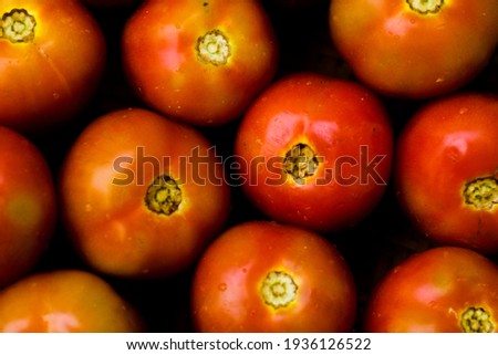 Photo of several tomatoes forming a pattern.