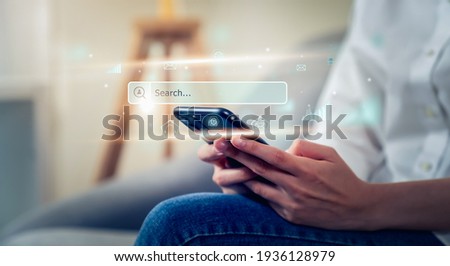 Woman hand using smartphone and press screen to search Browsing on the Internet online.