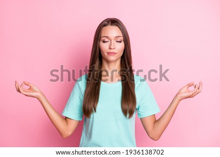 Photo portrait of calm brunette girl meditating practicing yoga closed eyes isolated on pastel pink color background
