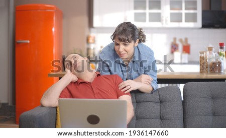 Young couple is shopping online from the computer. A young couple browsing online shopping sites looking for products. Online shopping concept.  Royalty-Free Stock Photo #1936147660
