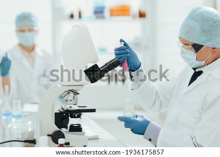close up. virologists work in the laboratory . Royalty-Free Stock Photo #1936175857