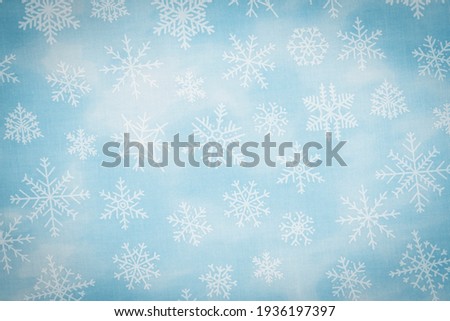 White and blue snowflake background with copy space for winter or holiday backgrounds