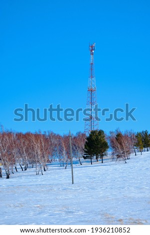 Telecommunications tower 4G and cellular 5G. Macro base station. radio network telecommunication equipment with radio modules and intelligent antennas installed on metal against the background of blue