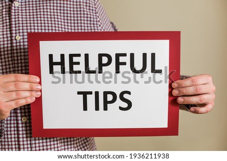 Image of man holding paper with  text helpful tips.