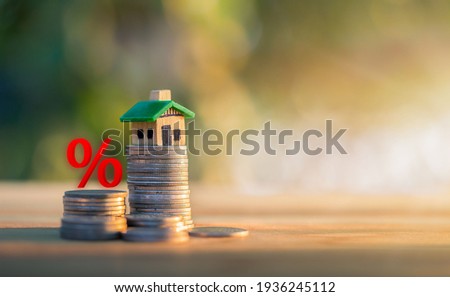 Mortgage rates business concept of investment housing real estate interest rates 3d home appraisal. planning savings money of coins to buy a home concept for property ladder, mortgage, real estate. Royalty-Free Stock Photo #1936245112