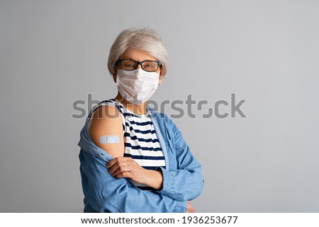 Senior woman after vaccination. Virus protection. COVID-2019. Royalty-Free Stock Photo #1936253677