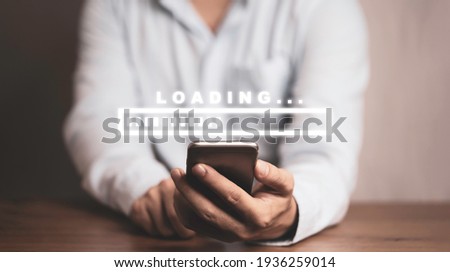 Businessman using smartphone for download and upload application and information, technology concept.