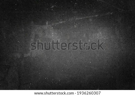 textured dark background with scratches, scuffs and stains. blank backdrop of black color for copy space Royalty-Free Stock Photo #1936260307