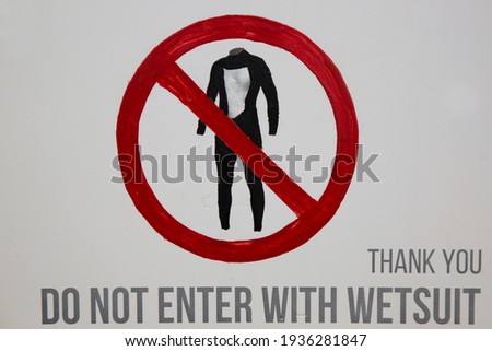 Self-painted prohibition sign to indicate that it is forbidden to enter the building with a wetsuit