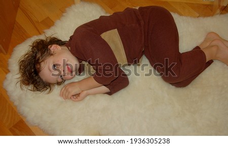Portrait of a boy in pajamas resting at home 