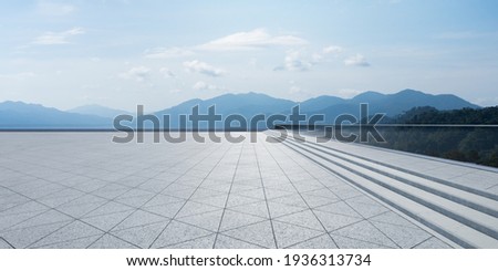 Empty triangle shape stone tiles floor with sky .