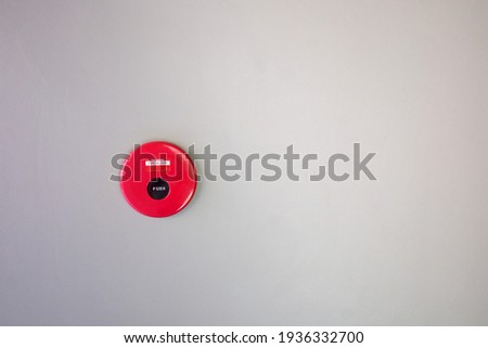 circle of firealarm on the grey wall