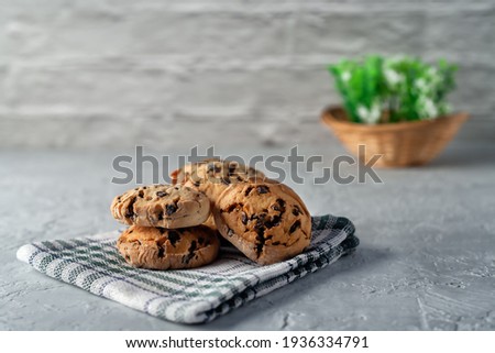 Fresh homemade cookies on a napkin on a light background