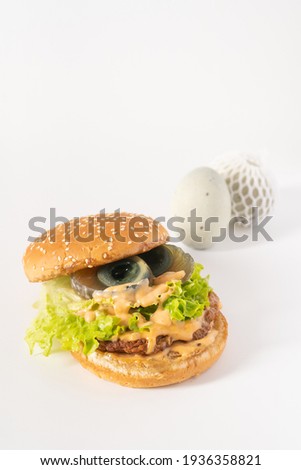 Chinese characteristic preserved egg burgers on a solid background