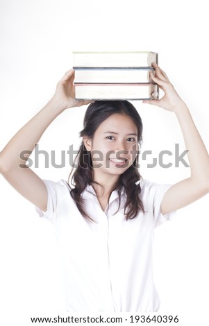 Girl in school uniform with books isolated on white background 