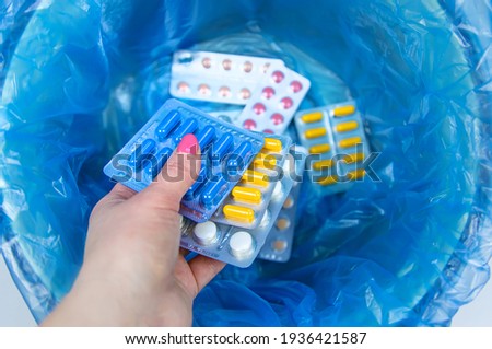 Throw away the tablets in the trash bin. Selective focus. medicine. Royalty-Free Stock Photo #1936421587