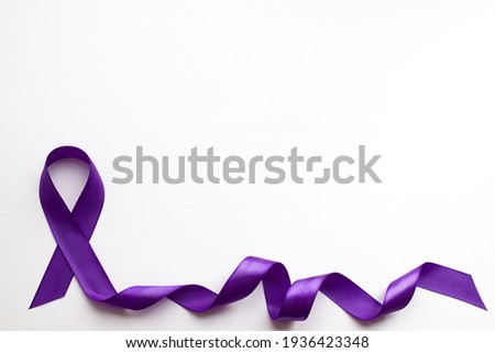 Purple ribbon on white background with place for text in honor of the day of patients with epilepsy on March 26 Royalty-Free Stock Photo #1936423348