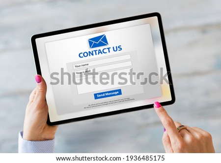 Person writing inquiry on contact form online Royalty-Free Stock Photo #1936485175