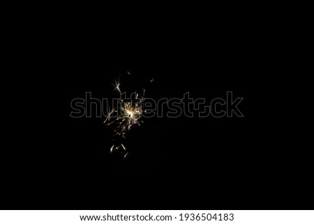 yellow sparks on a black background.