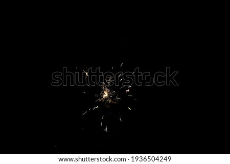 yellow sparks on a black background.