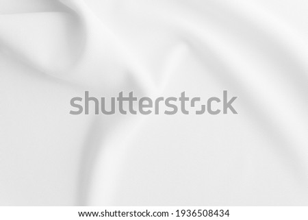 Blurred white wavy cloth background.
