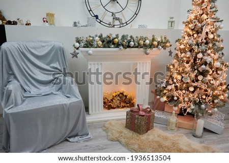 Cozy sofa and Christmas tree in the living room. The background of the photo studio. Photo shoot location