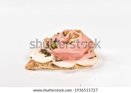 slice of Italian pizza topped with mortadella burrata and pistachios from Bronte Sicily isolated on white background