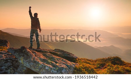 Winner on the mountain top. Sport and active life concept Royalty-Free Stock Photo #1936518442