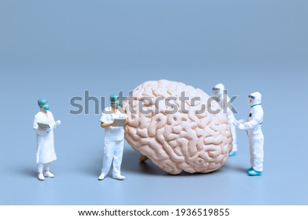 Miniature Doctor checking and analysis alzheimer's disease and dementia of brain, Science and medicine concept Royalty-Free Stock Photo #1936519855
