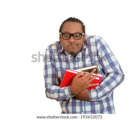 Closeup portrait young nerdy, funny looking man with glasses,  timid, shy, anxious, nervous, student holding books isolated white background. Human emotions, facial expressions, feelings, reaction