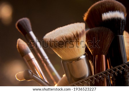 Close up photo of Makeup brushes with Bokeh Royalty-Free Stock Photo #1936523227