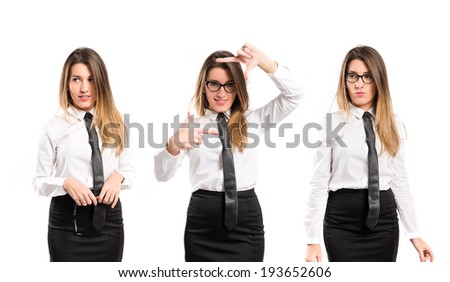 Pretty businesswoman focusing with her fingers on a white background 