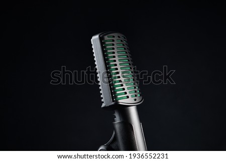 Close up studio microphone on black background