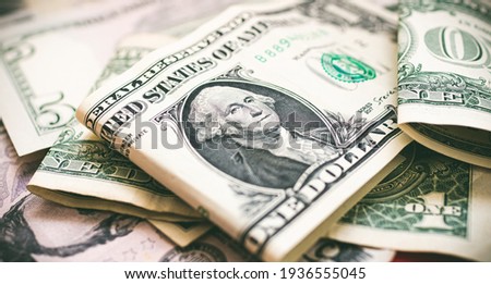 Money, US dollar bills background. Money scattered on the desk. Photography for Finance and Economy concepts.  Royalty-Free Stock Photo #1936555045