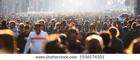 Blurred crowd of unrecognizable at the street Royalty-Free Stock Photo #1936574101