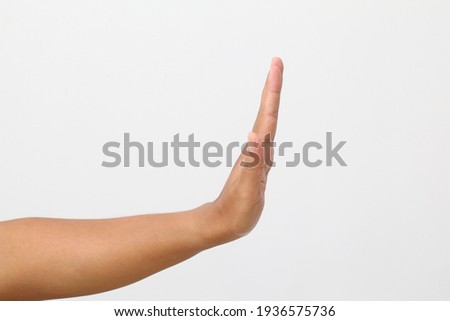 Man's hand with stop gesture. Isolated on white background Royalty-Free Stock Photo #1936575736
