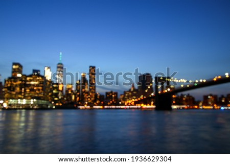Cityscape Manhattan bokeh, Blurred New York lights, NY and Brooklin Bridge at twilight time