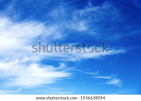 Beautiful sky background. Unusual cirrus clouds in the blue sky Royalty-Free Stock Photo #1936638094