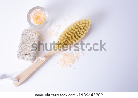 Bath accessories made of natural material, a set of zero waste for the bathroom, soap, cream, sea salt, a wooden brush on a white table. SPA treatments for youth and beauty. High quality photo