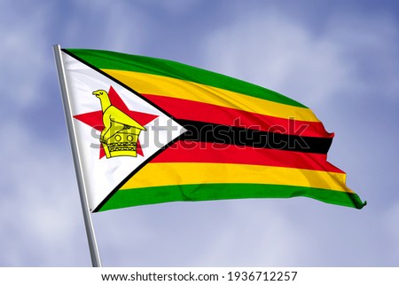 Zimbabwe flag isolated on sky background. close up waving flag of Zimbabwe. flag symbols of Zimbabwe.