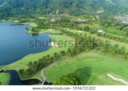 Aerial view Top down drone shot of beautiful golf field Beautiful green grass golf sport in summer day Travel and sport background concept.