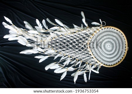 This art macrame craft made of crocheted rope for interior home decoration.