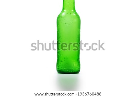 part of an empty green beer bottle on a white background, vertical photo