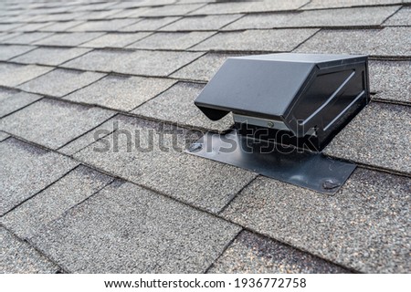 typical static passive vent installation on a residential roof Royalty-Free Stock Photo #1936772758